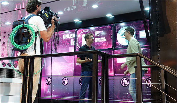 Video wall interview setup with camera operator